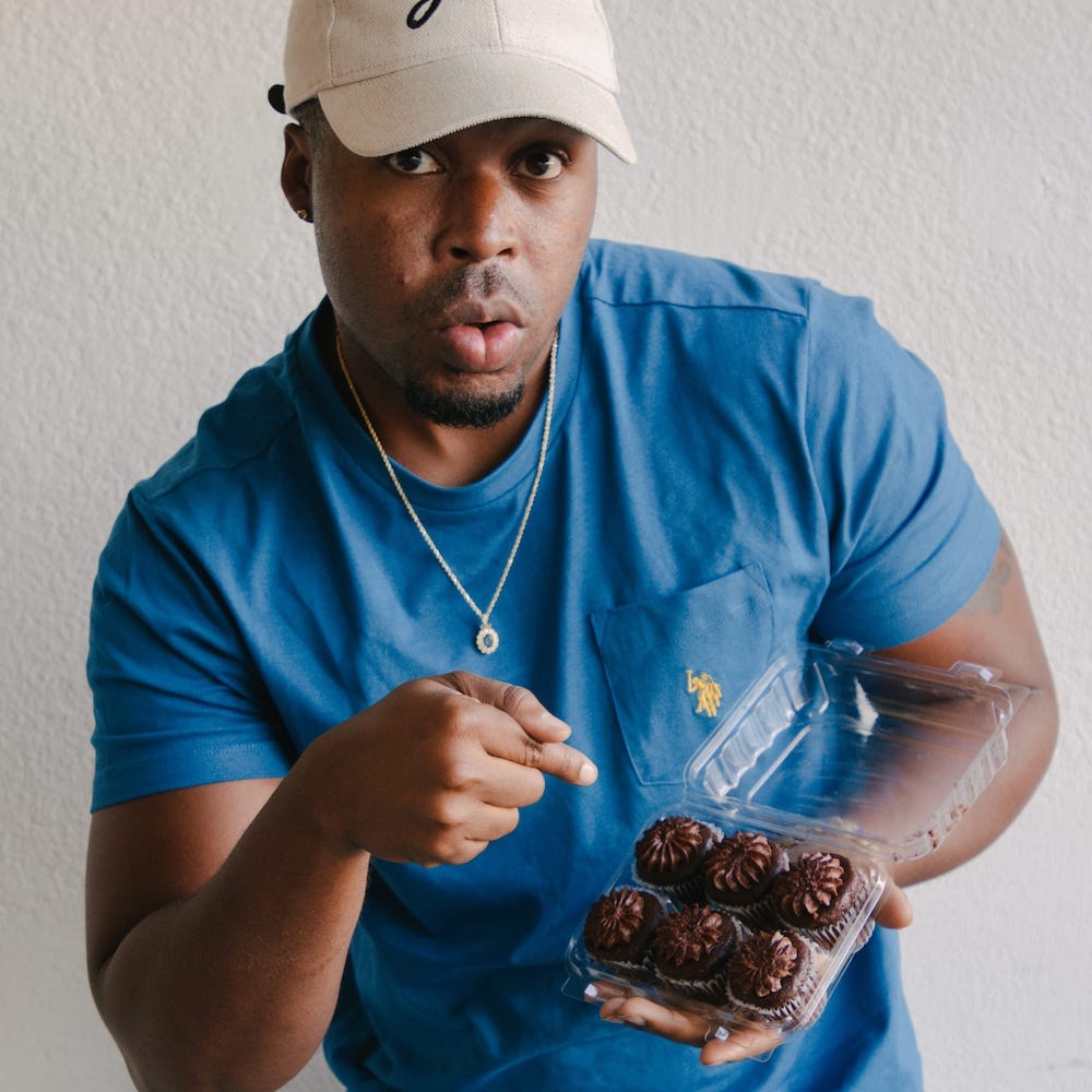 Mike Holding Delicious Cupcakes